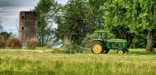 John Deere Tractor plowing field