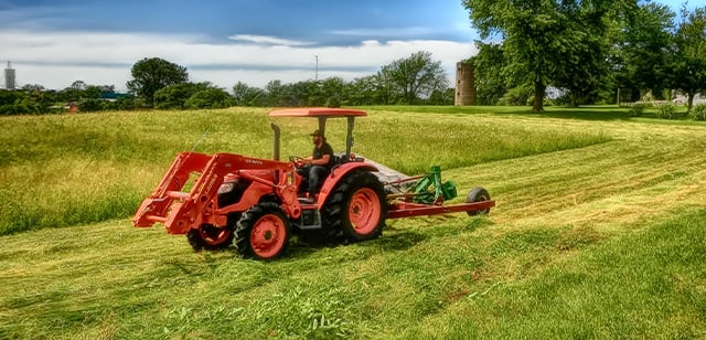 Kubota Tractor plowing field